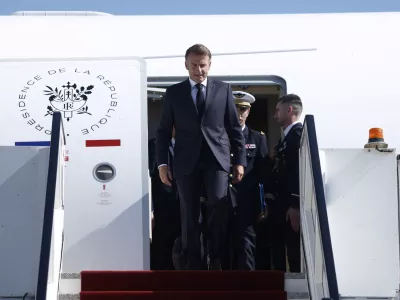 French President Emmanuel Macron arrives by plane to attend the Gaza Peace Summit, in Sharm el-Sheikh, Egypt, October 13, 2025. Yoan Valat/Pool via REUTERS
