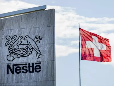 FILE PHOTO: A Swiss flag flutters on the headquarters of Nestle in Vevey, Switzerland, November 25, 2024. REUTERS/Denis Balibouse/File Photo