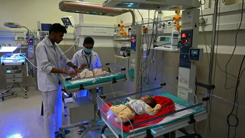 In this photograph taken on October 13, 2022, newborn babies lay on radiant warmers inside a special newborn care unit at a hospital in Amritsar. India is projected to see an explosion in its urban population in the coming decades, but its cities already cannot cope and climate change will make living conditions harsher still.,Image: 735878016, License: Rights-managed, Restrictions: To go with 'India-Population-Climate-Health', FOCUS, Model Release: no