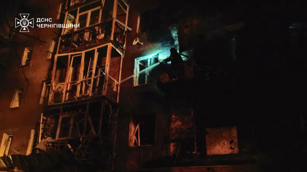 A firefighter works at the site of an apartment building hit during a Russian drone strike, amid Russia's attack on Ukraine, in the town of Nizhyn, Chernihiv region Ukraine in this handout picture released October 16, 2025. Press service of the State Emergency Service of Ukraine in Chernihiv region/Handout via REUTERS ATTENTION EDITORS - THIS IMAGE HAS BEEN SUPPLIED BY A THIRD PARTY. MUST NOT OBSCURE LOGO.