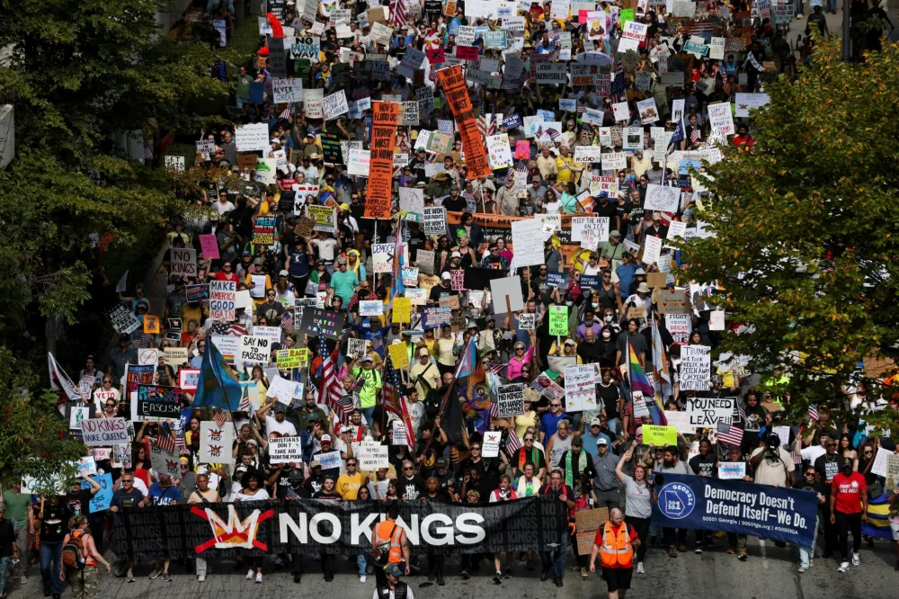 People attend a "No Kings" protest against U.S. President Donald Trump's policies, in Atlanta, Georgia, U.S., October 18, 2025. REUTERS/Alyssa Pointer