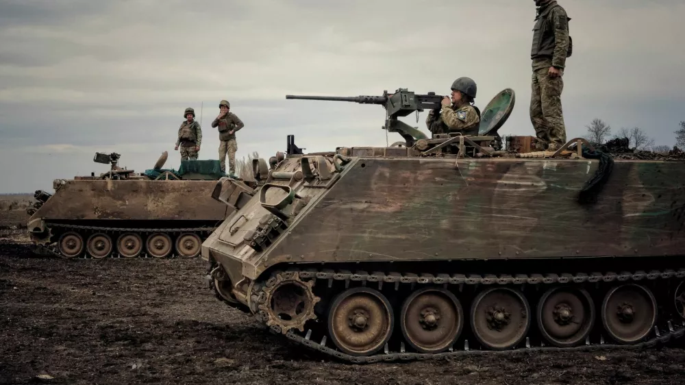 Ukrainian servicemen train to shoot a machine gun from M113 Armoured Personnel Carrier (APC) during a training session, amid Russia's invasion of Ukraine, in Donbas region, Ukraine April 8, 2023. REUTERS/Yan Dorbronosov