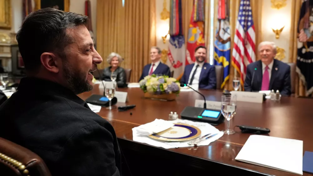 Ukraine's President Volodymyr Zelenskyy speaks as President Donald Trump, from right, Vice President JD Vance, Treasury Secretary Scott Bessent and White House Chief of Staff Susie Wiles listen before a lunch with in the Cabinet Room of the White House, Friday, Oct. 17, 2025, in Washington. (AP Photo/Alex Brandon)