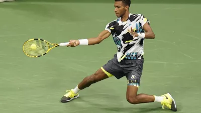 Felix Auger-Aliassime, of Canada, returns a shot to Andy Murray, of Great Britain, during the third round of the U.S. Open tennis championships, Thursday, Sept. 3, 2020, in New York. (AP Photo/Frank Franklin II)