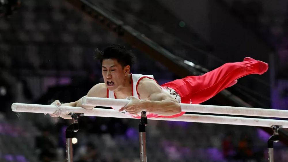 Artistic Gymnastics - 2025 World Artistic Gymnastics Championships - Men's Artistic Gymnastics - Qualifications - Indonesia Arena, Jakarta, Indonesia - October 19, 2025 Japan's Daiki Hashimoto in action on the parallel bars REUTERS/Jennifer Lorenzini