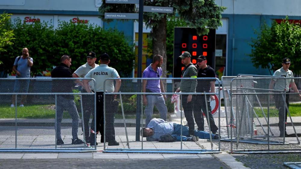 A person is detained after shooting incident of Slovak PM Robert Fico, after a Slovak government meeting in Handlova, Slovakia, May 15, 2024. REUTERS/Radovan Stoklasa