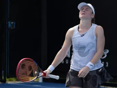 Tamara Zidansek of Slovenia reacts during her first round match against Anastasia Potapova of Russia at the Australian Open tennis championship in Melbourne, Australia, Monday, Jan. 13, 2025. (AP Photo/Manish Swarup)