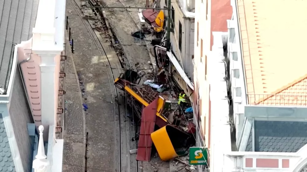 FILE PHOTO: A drone view shows the site of the accident after Gloria Funicular railway car, a popular tourist attraction, derailed and crashed, resulting in multiple casualties, according to authorities, in Lisbon, Portugal, September 4, 2025. REUTERS TV/via REUTERS. PORTUGAL OUT. NO COMMERCIAL OR EDITORIAL SALES IN PORTUGAL/File Photo