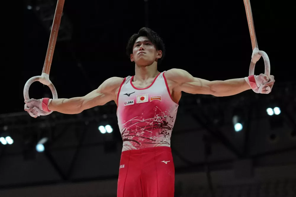Daiki Hashimoto of Japan competes in the Men's All-Around Final during the 53rd Artistic Gymnastics World Championships in Jakarta, Indonesia, Wednesday, Oct. 22, 2025. (AP Photo/Dita Alangkara)