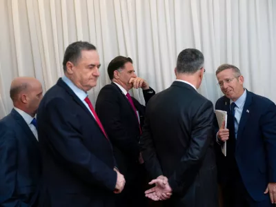Members of Israeli Prime Minister Benjamin Netanyahu's government including Minister of Defense Israel Katz and Cabinet Secretary Yossi Fuchs speak before a meeting between U.S. Vice President JD Vance and Prime Minister Netanyahu at the Prime Minister's Office in Jerusalem, Wednesday, Oct. 22, 2025. (Nathan Howard/The New York Times via AP, Pool)