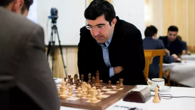 FILE - Russian chess grandmaster Vladimir Kramnik, right, concentrates during his game against U.S. grandmaster Lewon Aronjan during the Zurich Chess Challenge 2015 Round 3 in Zurich, Feb. 16, 2015. (Ennio Leanza/Keystone via AP)