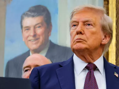 FILE PHOTO: U.S. President Donald Trump, in front of a painting of former U.S. President Ronald reagan, attends an event to announce that the Space Force Command will move from Colorado to Alabama, in the Oval Office at the White House in Washington, D.C., U.S., September 2, 2025. REUTERS/Brian Snyder/File Photo