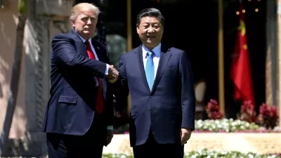 FILE PHOTO: U.S. President Donald Trump (L) and China's President Xi Jinping shake hands while walking at Mar-a-Lago estate after a bilateral meeting in Palm Beach, Florida, U.S., April 7, 2017. REUTERS/Carlos Barria/File Photo