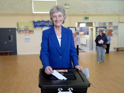 Independent candidate Catherine Connolly casts her vote in the election for the next Irish president at Claddagh National School in Galway city, Ireland, Friday, Oct. 24, 2025. (Brian Lawless/PA via AP)