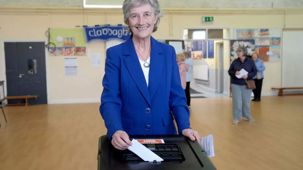 Independent candidate Catherine Connolly casts her vote in the election for the next Irish president at Claddagh National School in Galway city, Ireland, Friday, Oct. 24, 2025. (Brian Lawless/PA via AP)
