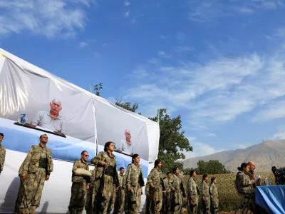 Fighters with the Kurdistan Workers' Party (PKK) line up during a disarmament ceremony marking a significant step toward ending the decades-long conflict between Turkey and the outlawed group in Qandil mountains, Iraq October 26, 2025. REUTERS/Thaier Al-Sudani