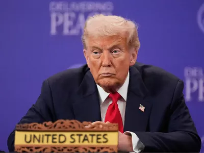 President Donald Trump reacts during a signing ceremony on the sidelines of the ASEAN Summit in Kuala Lumpur, Malaysia, Sunday, Oct. 26, 2025. (AP Photo/Mark Schiefelbein)