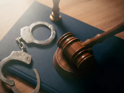 Handcuffs and wooden gavel. Crime, legal and violence concept.