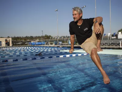 FILE - In this Feb. 1, 2011 photo, former Olympic gold medalist and diving coach Greg Louganis poses for photos in Fullerton, Calif. As an athlete mentor at the London Olympics, Louganis is trying to make sure the stress of winning medals isn't heaped on the shoulders of American divers, who have been chasing his standard of excellence since Louganis became the sport's icon in the 1980s. The U.S. has been blanked in diving in two consecutive Olympics, and hasn't won a gold since 2000. (AP Photo/Jae C. Hong, File)