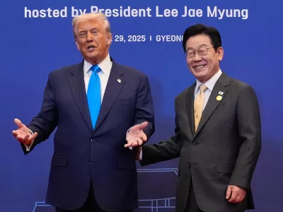 President Donald Trump poses for a photo with South Korean President Lee Jae Myung during a dinner event in Gyeongju, South Korea, Wednesday, Oct. 29, 2025. (AP Photo/Mark Schiefelbein)