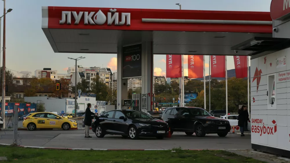 A person is seen refueling a car at a Lukoil petrol station Lukoil in Sofia, Bulgaria, Tuesday, Oct. 28, 2025. (AP Photo/ Valentina Petrova)
