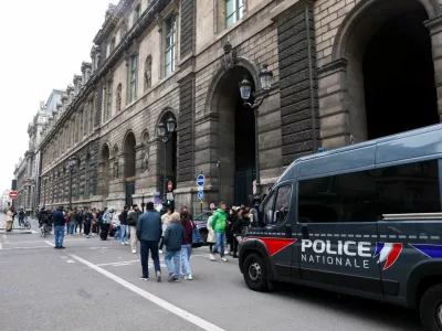 Police vehicle stands near the entrance to the Louvre museum after reports of a robbery, in Paris, France, October 19, 2025. REUTERS/Gonzalo Fuentes