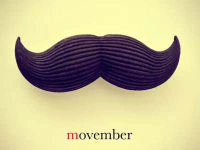 the word movember and a mustache on a beige background with a retro effect