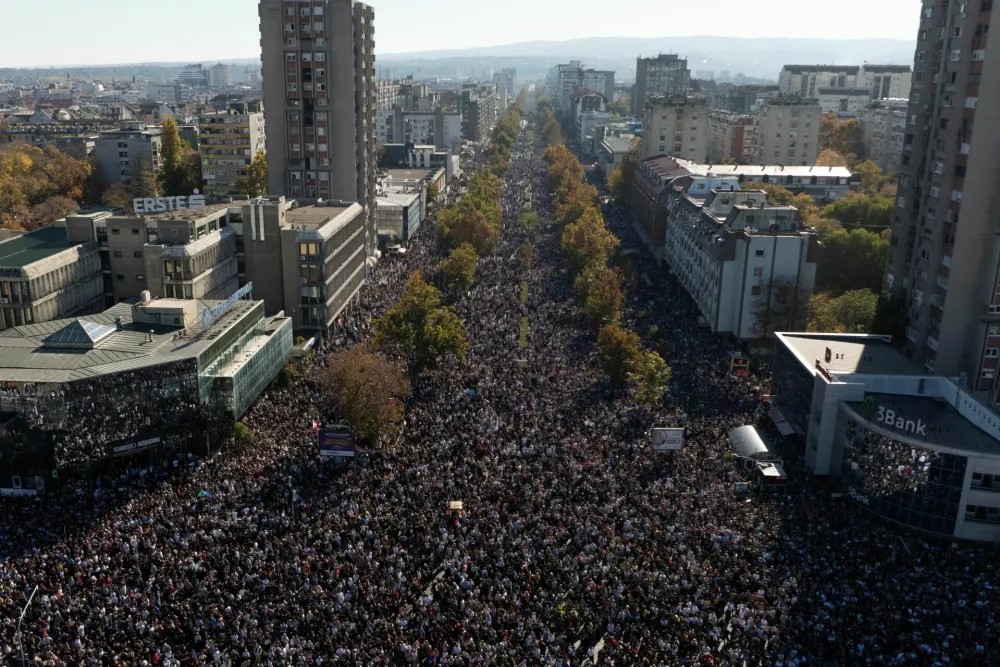 A drone view shows people gathering outside Novi Sad railway station during a commemorative service, on the first anniversary of the fatal November 2024 canopy collapse of the station, which killed 16 people, triggering nationwide accusations of widespread corruption and negligence, in Novi Sad, Serbia, November 1, 2025. REUTERS/Marko Djurica