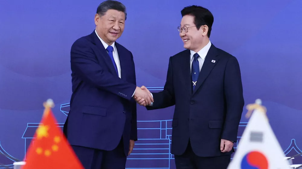 China's President Xi Jinping shakes hands with South Korea's President Lee Jae Myung during their meeting in Gyeongju, South Korea, November 1, 2025.  Yonhap via REUTERS  THIS IMAGE HAS BEEN SUPPLIED BY A THIRD PARTY. NO RESALES. NO ARCHIVES. SOUTH KOREA OUT. NO COMMERCIAL OR EDITORIAL SALES IN SOUTH KOREA.