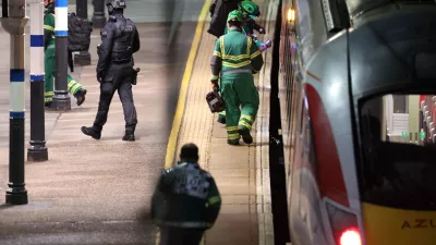 Emergency personnel inspect a train at the Huntingdon, England, train station in Cambridgeshire after people were stabbed Saturday, Nov. 1, 2025. (Chris Radburn/PA via AP)