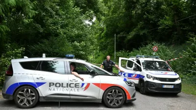 Police France, francija, policija, french police, francoska policijaPolice cars are parked in front of a cordoned-off area, near a sports field where a 32-year-old man was found dead with his throat slit and gutted, in Pont-de-Metz on August 4, 2025. The victim had stab wounds to the neck and back and has been found by a walker in a cross position, police told AFP.,Image: 1027676326, License: Rights-managed, Restrictions:, Model Release: no