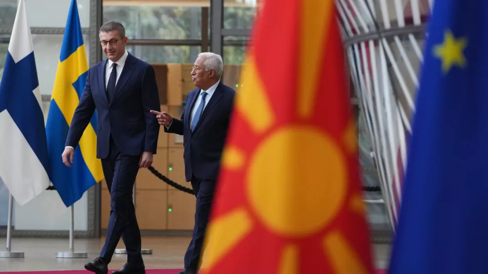 European Council President Antonio Costa, right, walks with North Macedonia's Prime Minister Hristijan Mickoski prior to a meeting at the European Council building in Brussels, Belgium, Tuesday, Nov. 4, 2025. (AP Photo/Virginia Mayo)