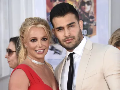 FILE - Britney Spears and Sam Asghari appear at the Los Angeles premiere of "Once Upon a Time in Hollywood" on July 22, 2019. Asghari has filed for divorce from Spears, a person familiar with the filing said late Wednesday, Aug. 16, 2023. The person, who is close to Asghari but not authorized to speak publicly, confirmed the filing happened Wednesday, hours after several outlets including TMZ and People magazine reported the couple had separated. (Photo by Jordan Strauss/Invision/AP, File)