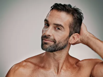 Beauty, salon and skincare with portrait of man in studio for cleaning, grooming and dermatology. Self care, cosmetics and aesthetic with male person on background for facial and spa treatment / Foto: Jacob Wackerhausen