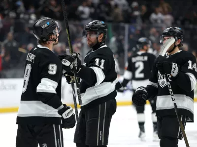 Nov 4, 2025; Los Angeles, California, USA; Los Angeles Kings center Anze Kopitar (11) celebrates a win with right wing Adrian Kempe (9) after defeating the Winnipeg Jets 3-0 at Crypto.com Arena. Mandatory Credit: Kiyoshi Mio-Imagn Images
