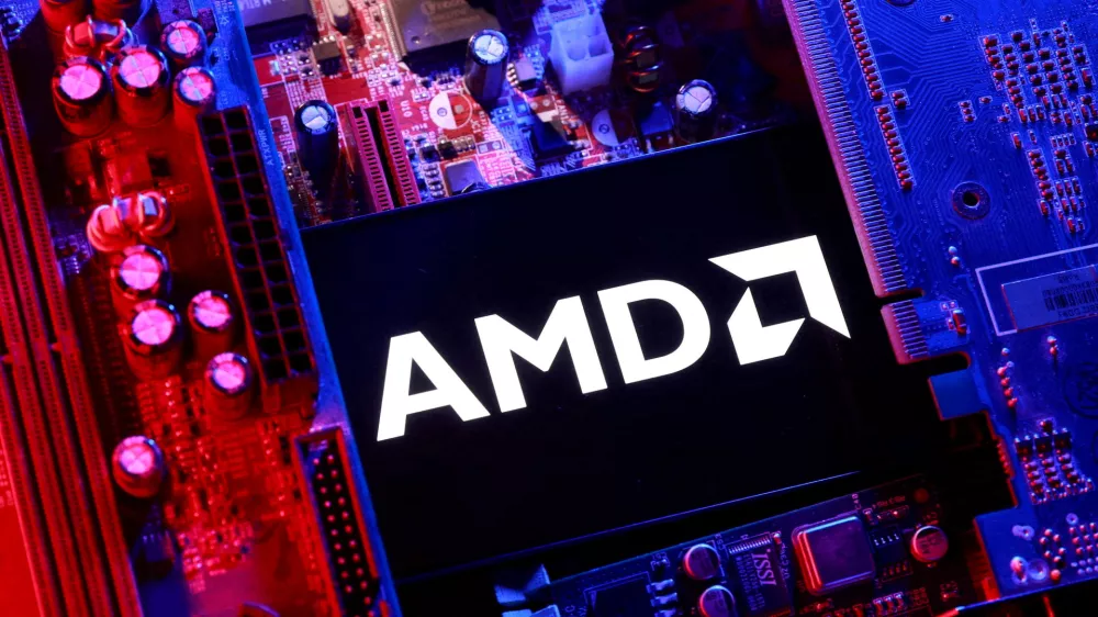 FILE PHOTO: An AMD logo and a computer motherboard appear in this illustration taken August 25, 2025. REUTERS/Dado Ruvic/Illustration/File Photo