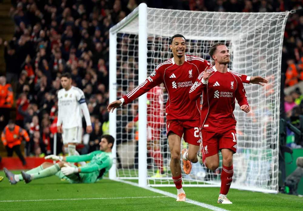 Soccer Football - UEFA Champions League - Liverpool v Real Madrid - Anfield, Liverpool, Britain - November 4, 2025 Liverpool's Alexis Mac Allister celebrates scoring their first goal with Hugo Ekitike Action Images via Reuters/Jason Cairnduff   TPX IMAGES OF THE DAY