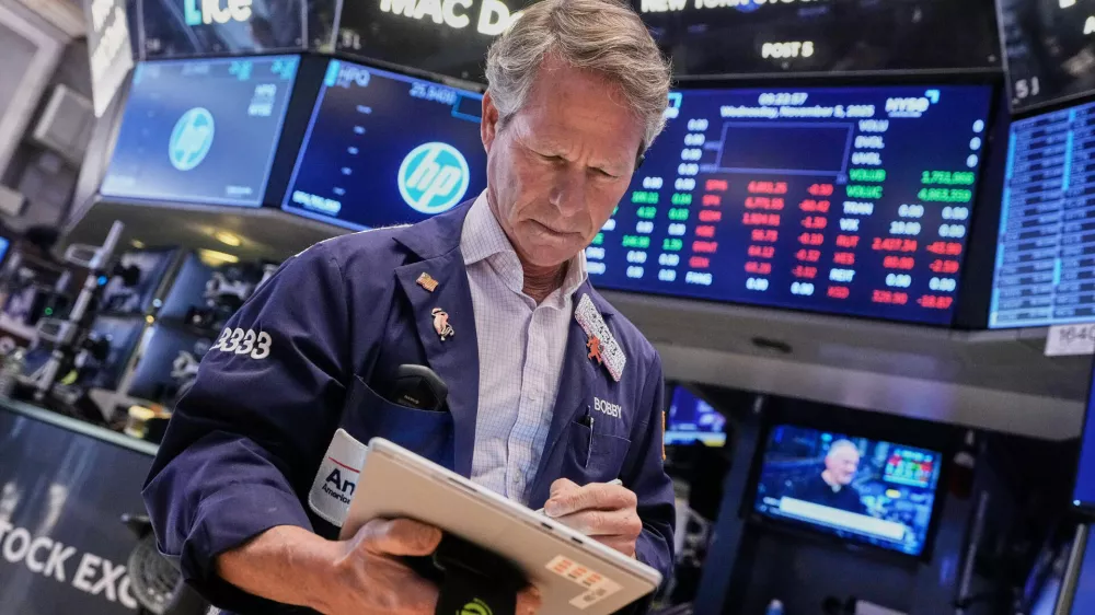 Trader Robert Charmak works on the floor of the New York Stock Exchange, Wednesday, Nov. 5, 2025. (AP Photo/Richard Drew)