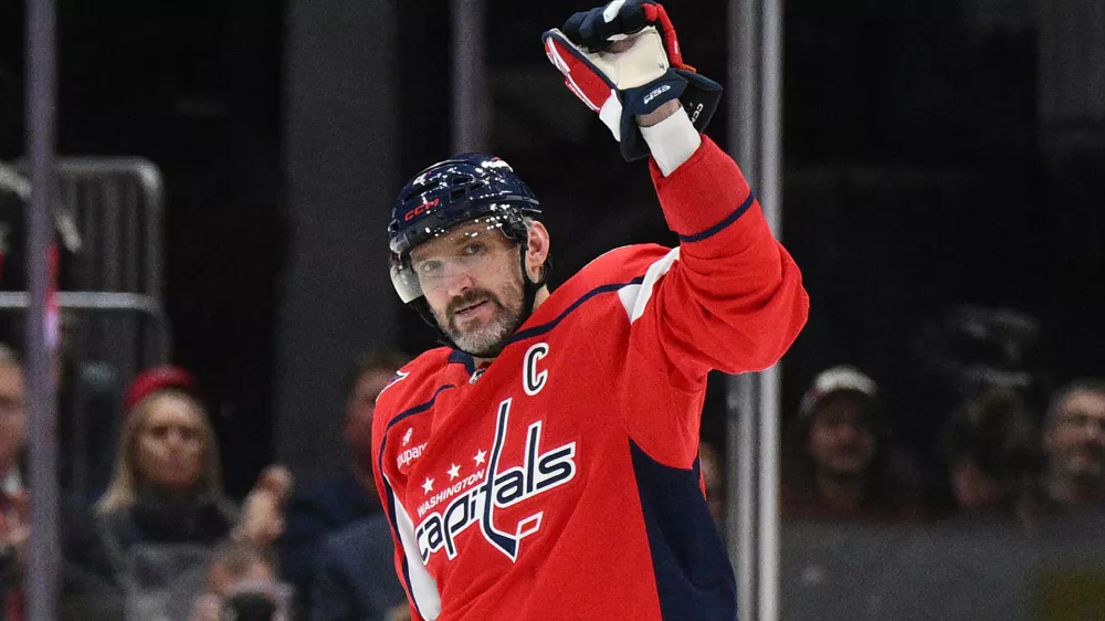 Washington Capitals left wing Alex Ovechkin (8) celebrates his 900th career NHL goal during the second period of an NHL hockey game against the St. Louis Blues, Wednesday, Nov. 5, 2025, in Washington. (AP Photo/Nick Wass)