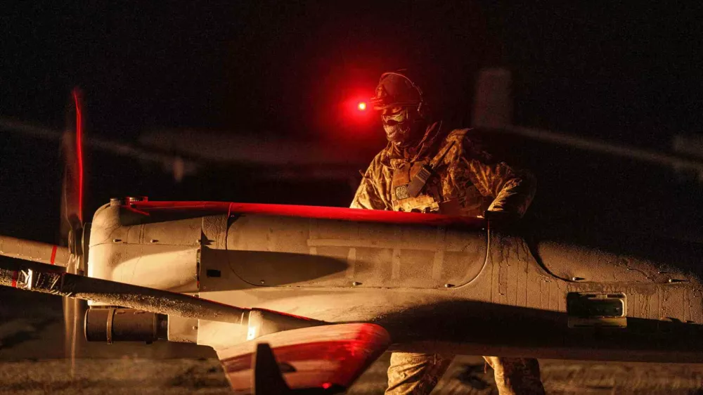 FILE - A Ukrainian serviceman of the 14th Separate Unmanned Aerial Systems Regiment prepares a long-range drone An-196 Liutyi before takeoff in undisclosed location, Ukraine, Tuesday, Oct. 14, 2025. (AP Photo/Evgeniy Maloletka, File)