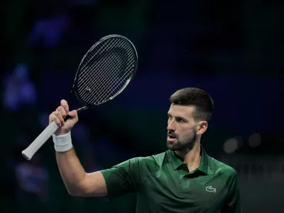 Novak Djokovic of Serbia celebrates after winning a set against Alejandro Tabilo of Chile during the ATP tournament round of 16 tennis match, in Athens, Greece, Tuesday, Nov. 4, 2025. (AP Photo/Petros Giannakouris)
