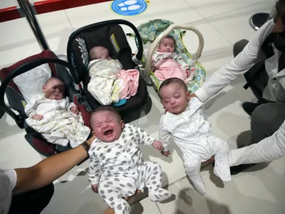 ISTANBUL, TURKEY - JULY 27: Huseyin Huyluoglu and his wife Merve Ozer Huyluoglu with their children including quintuplets arrive at Istanbul Airport in Istanbul, Turkey on July 27, 2020. Huyluoglu family was brought to Turkey by Ministry of Family, Labour and Social Services as they had hard times due to coronavirus (Covid-19) pandemic in Saudi Arabia. Isa Terli / Anadolu Agency,Image: 548084784, License: Rights-managed, Restrictions:, Model Release: no