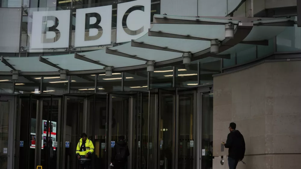 A person walks outside the BBC Headquarters in London, Monday, Nov. 10, 2025. (AP Photo/Kin Cheung)