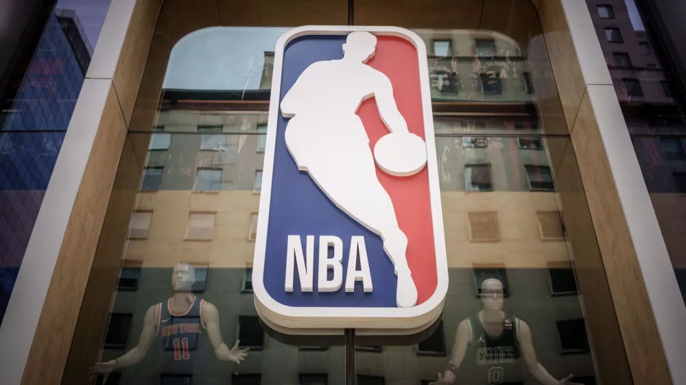 FILED - 16 September 2023, US, New York: The logo of the US Basketball League NBA is pictured on an NBA fan store in Manhattan. Photo: Michael Kappeler/dpa