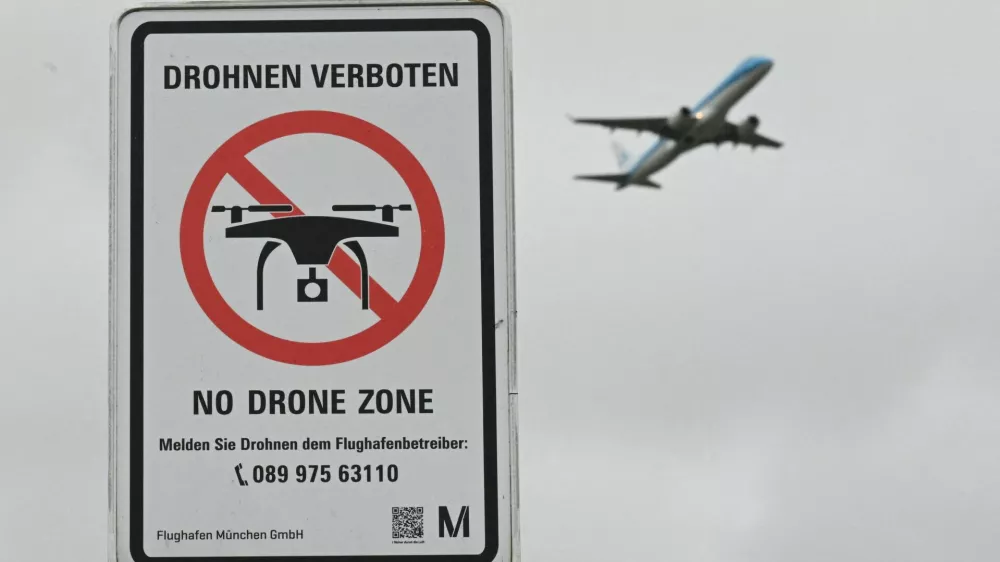 FILE PHOTO: A sign with a drone ban is displayed outside the airport in Munich, Germany October 6, 2025. REUTERS/Angelika Warmuth/File Photo