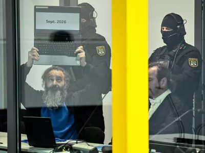 Suspect Taleb al-Abdulmohsen, a 51-year-old doctor from Saudi Arabia, who faces charges of murder, attempted murder and dangerous interference with road traffic, shows a laptop with the text "Sept. 2026", at the opening of his trial for the Magdeburg Christmas market attack, at a regional court in Magdeburg, Germany, November 10, 2025. REUTERS/Annegret Hilse