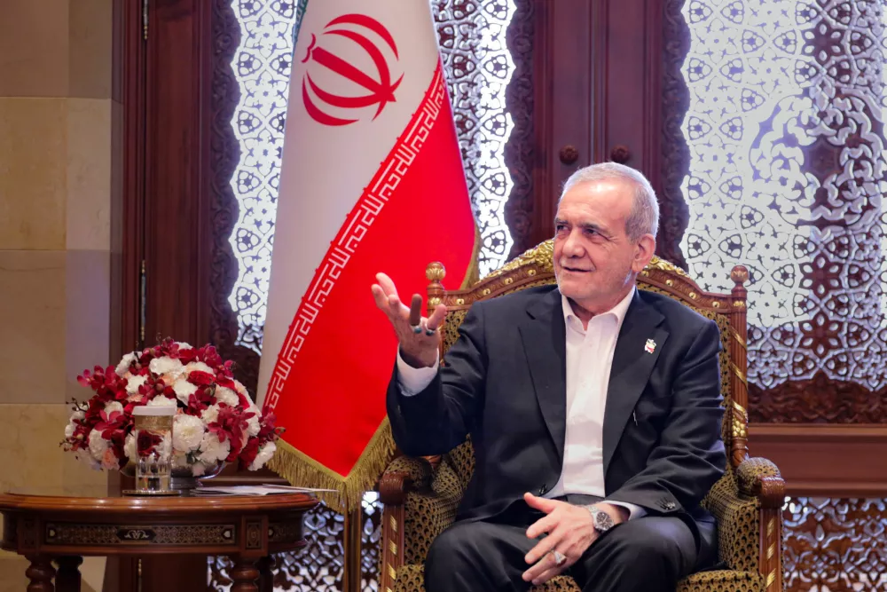 FILED - 28 May 2025, Oman, Muscat: Iran's President Masoud Pezeshkian speaks with Sayyid Fahd Bin Mahmoud Al-Said (not pictured), the Deputy Prime Minister for the Council of Ministers in the Sultanate of Oman as they meet in Muscat. Photo: --/Iranian Presidency/dpa - ATTENTION: editorial use only and only if the credit mentioned above is referenced in full