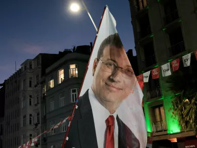 FILE PHOTO: A flag with an image of the jailed Istanbul Mayor Ekrem Imamoglu from the main opposition Republican People's Party (CHP), is displayed during a rally to protest the detention of Beyoglu Mayor Inan Guney as part of a corruption investigation, in Istanbul, Turkey, August 27, 2025. REUTERS/Murad Sezer/File Photo
