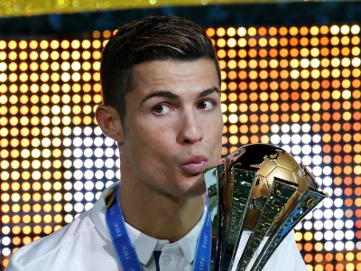 FILE PHOTO: Football Soccer - Real Madrid v Kashima Antlers - FIFA Club World Cup Final - International Stadium Yokohama - Japan, 18/12/16 Real Madrid's Cristiano Ronaldo celebrates winning the FIFA Club World Cup Final with the trophy Reuters / Kim Kyung-Hoon Livepic/File Photo