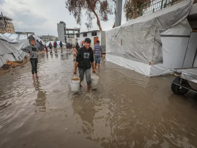 GAZA CITY, GAZA - NOVEMBER 14: Palestinians, whose homes were destroyed during Israel's two-year attacks, have hard times trying to evacuate the water after their makeshift tents were flooded with the intense rain at Al Yarmouk Camp in Gaza City, Gaza on November 14, 2025. The onset of cold weather and rainfall has made living conditions even more difficult for residents living in makeshift tents. Hamza Z. H. Qraiqea / AnadoluNo Use USA No use UK No use Canada No use France No use Japan No use Italy No use Australia No use Spain No use Belgium No use Korea No use South Africa No use Hong Kong No use New Zealand No use Turkey
